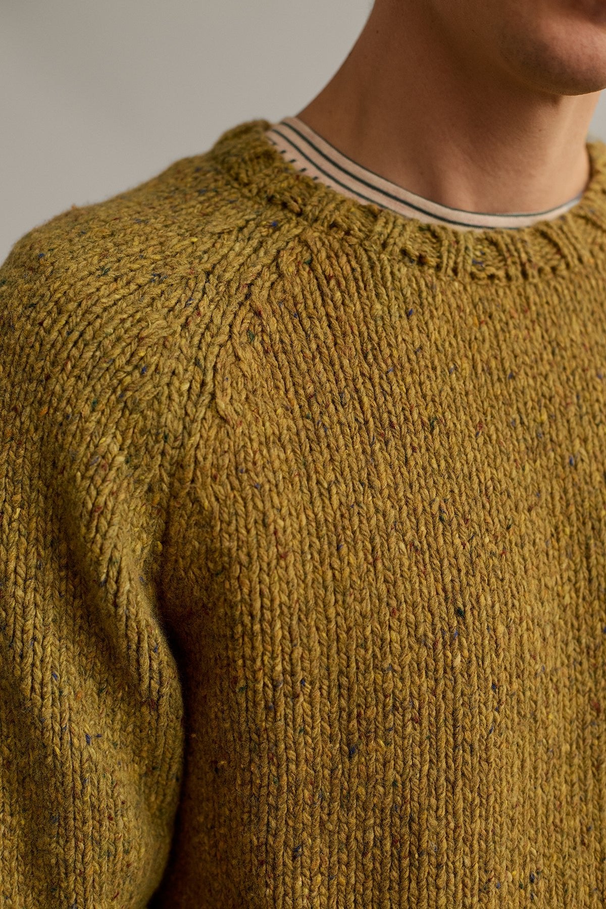 green knit flecked with colourful neps
