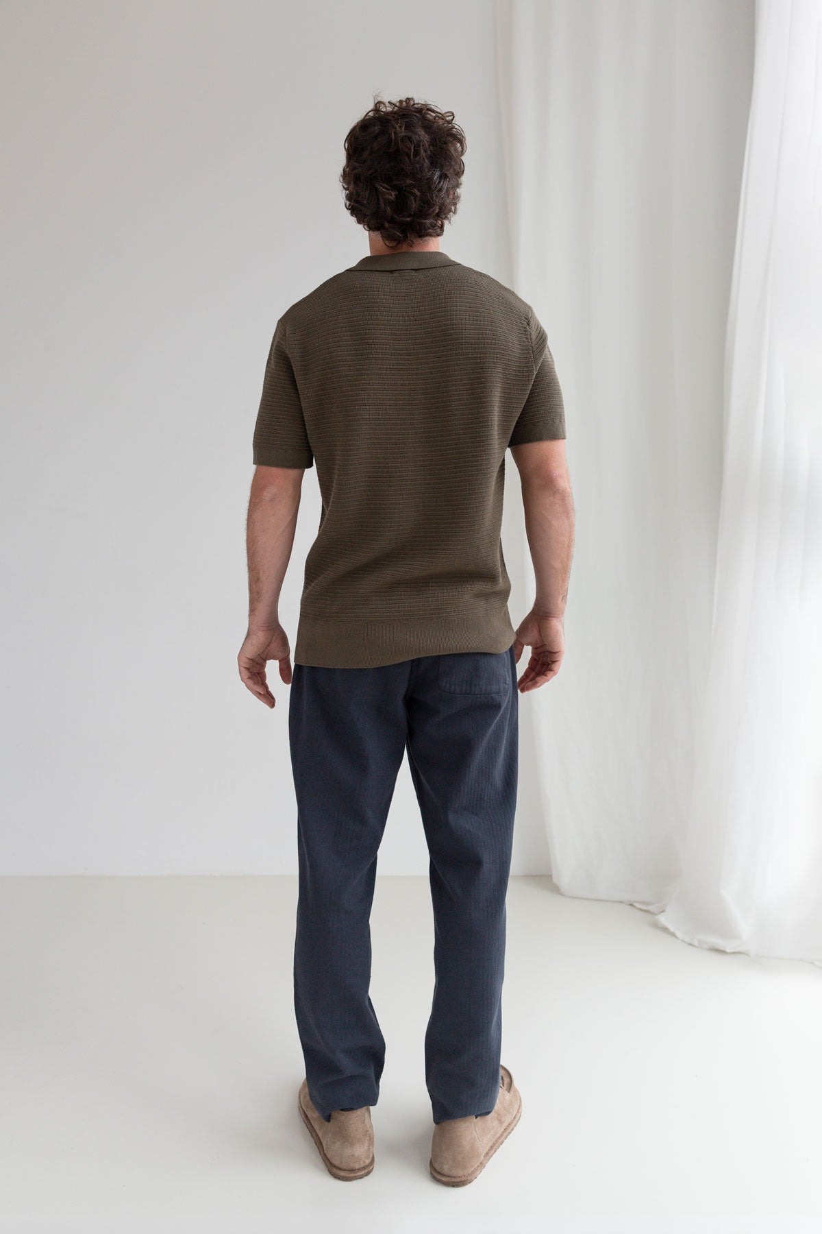 Navy straight leg pants men full body view back