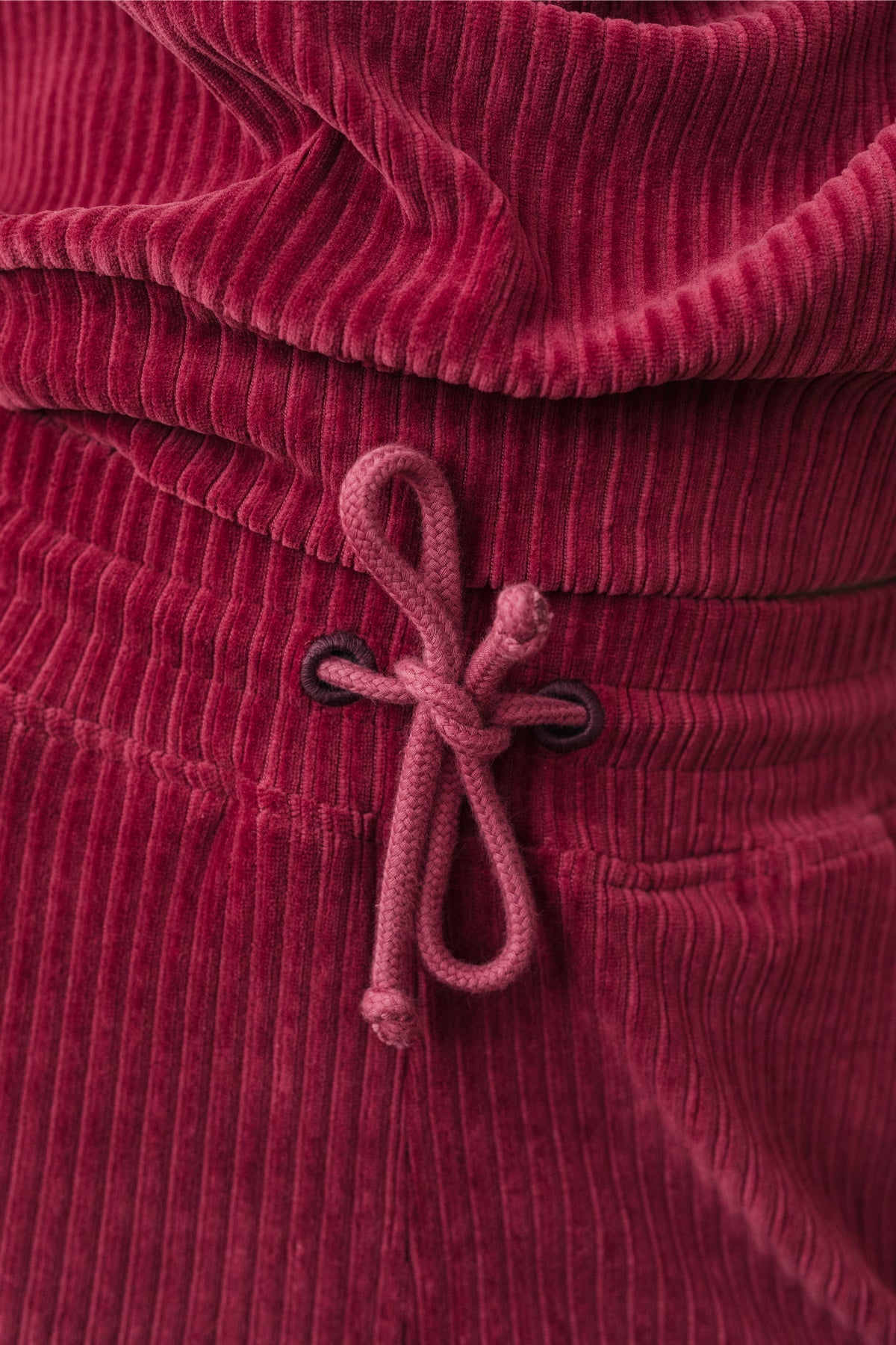 sustainable cranberry velvet fabric pants with rope drawstring.