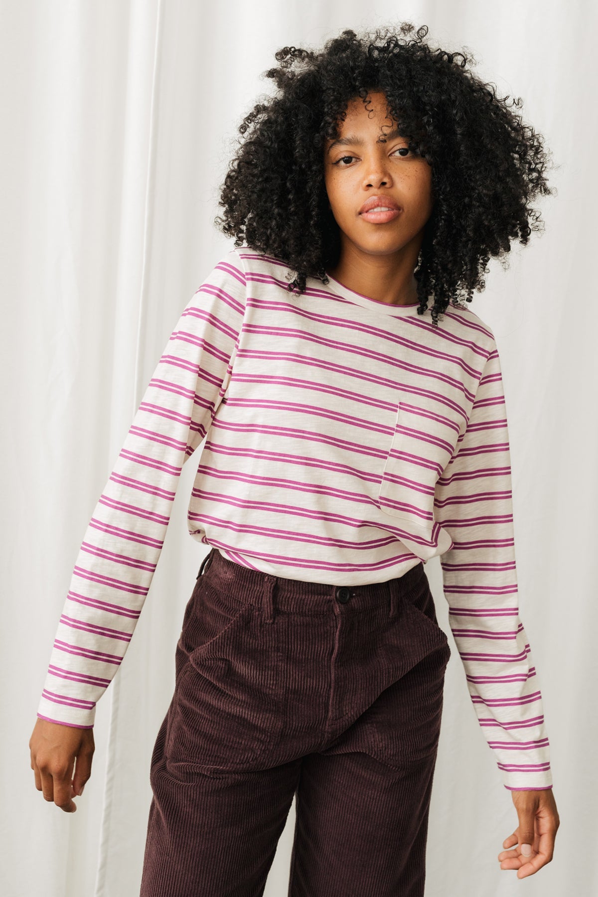 women top with yarn-dyed stripes with breast pocket.