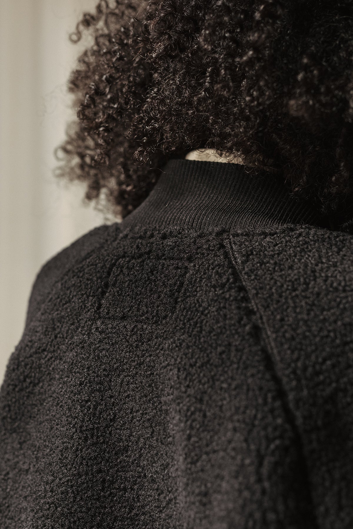 Black bomber with raglan sleeves