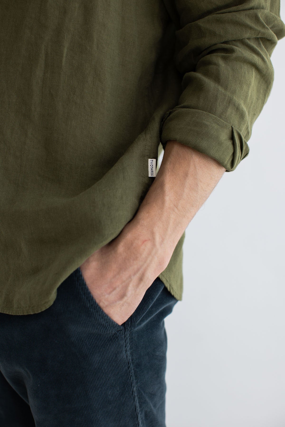 Codium green linen shirt men navy pants detail front