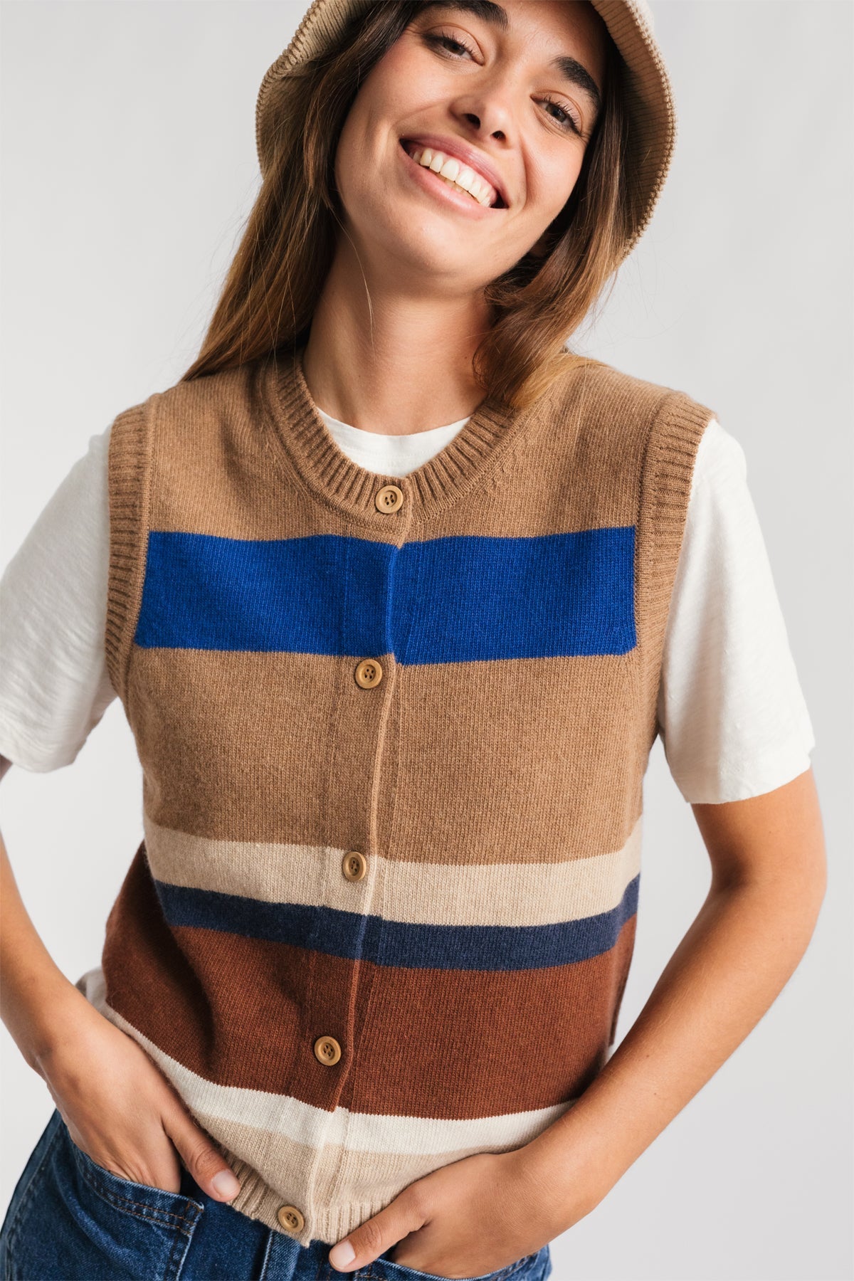 sleeveless cardigan layered over a tee