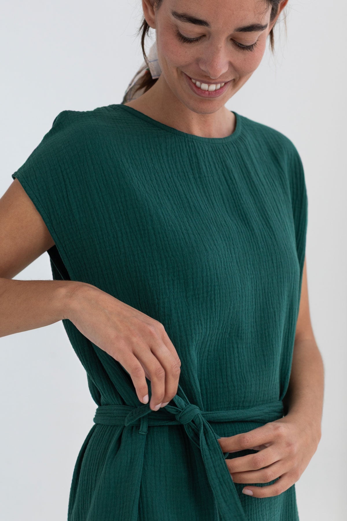 Dark green muslin dress detail front