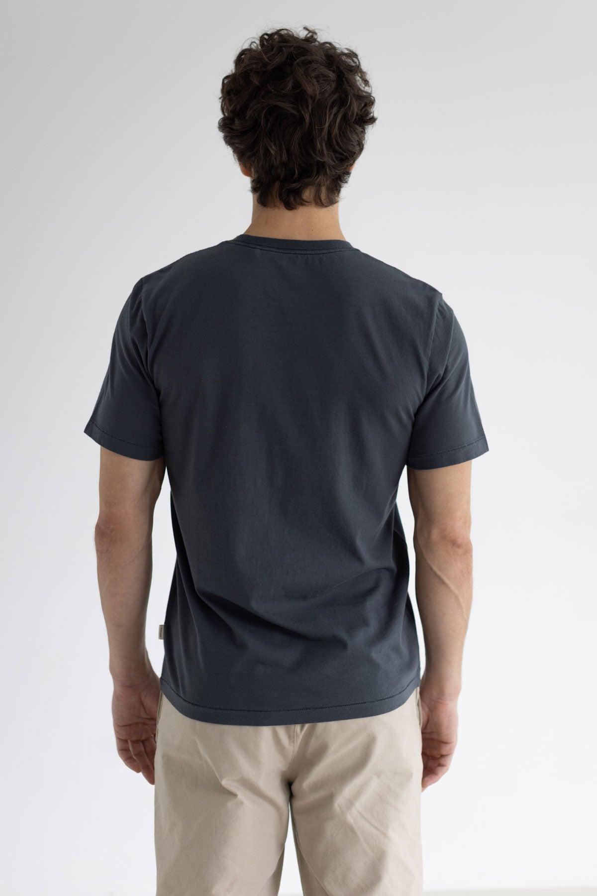 Dark sand graphic tshirt men light pants wear view back