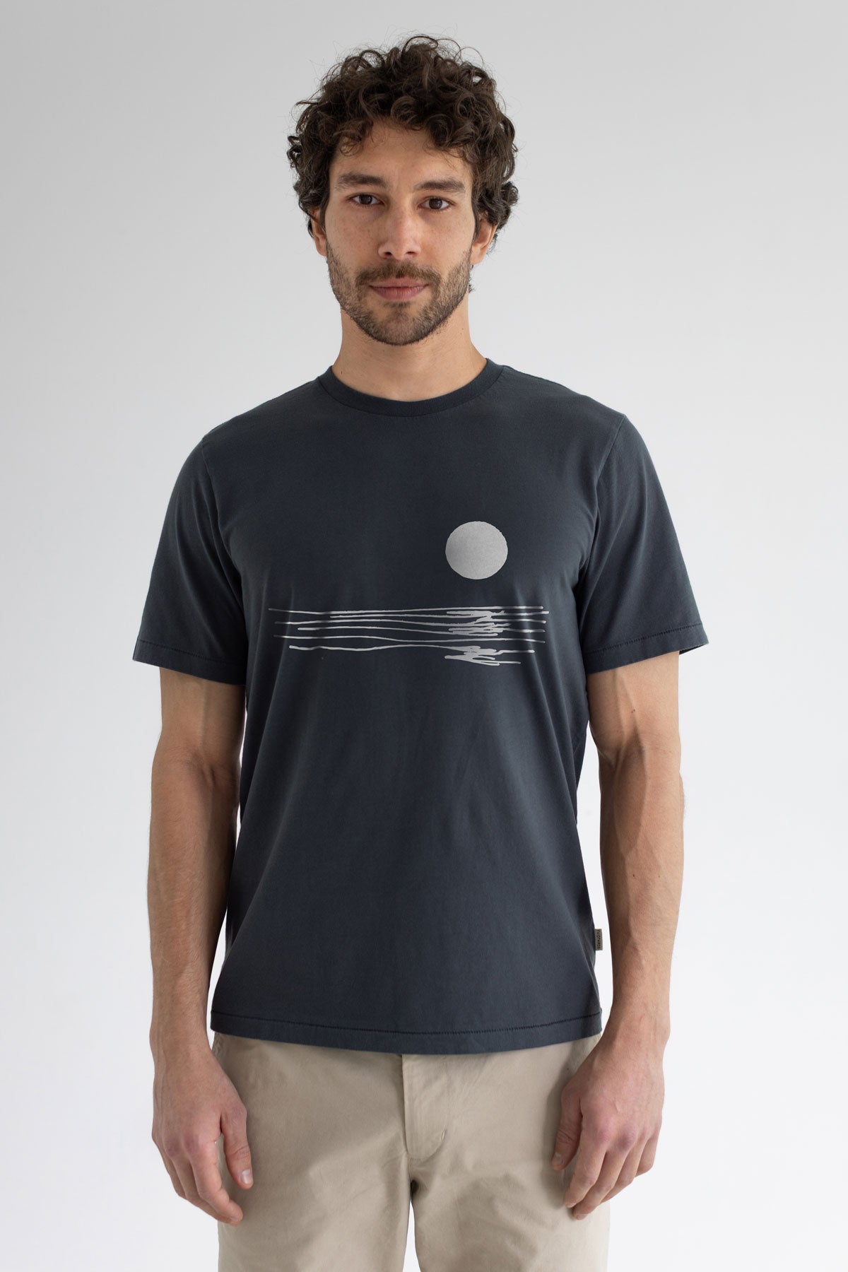 Dark sand graphic tshirt men light pants wear view front