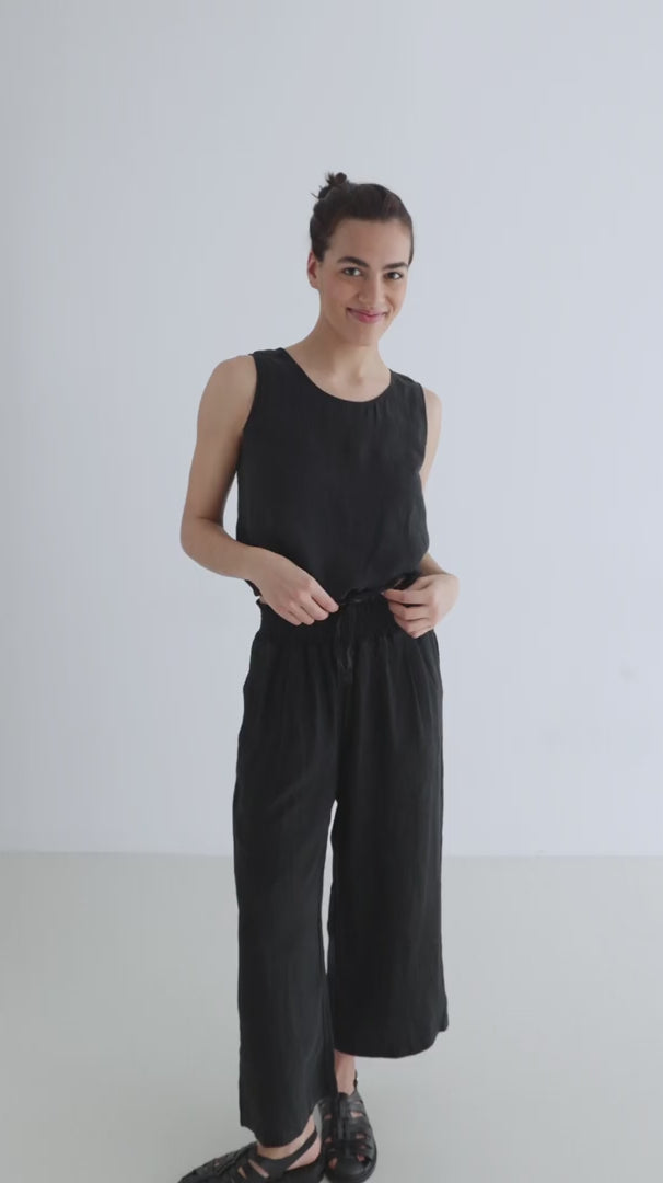 Black linen pants women black top full body view 
