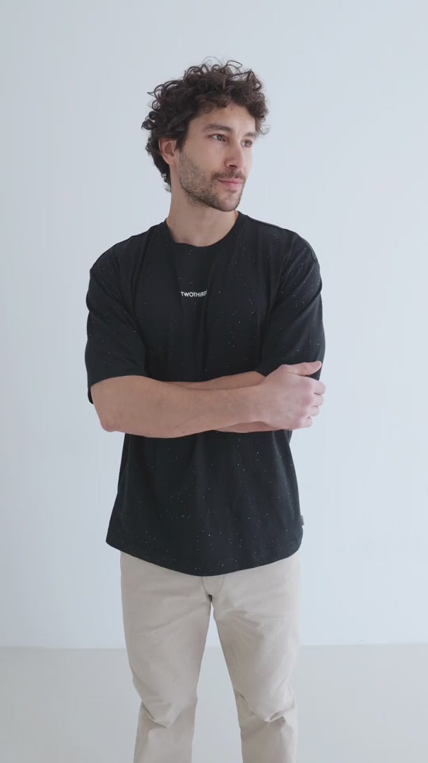 Black Oversized t-shirt men light pants full body view