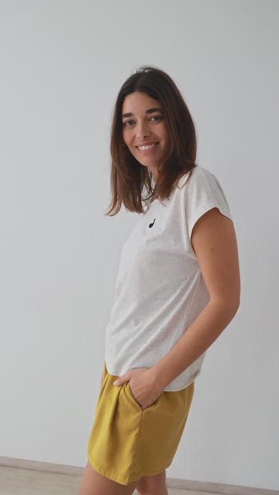 Mustard Lyocell shorts white tshirt women full body view 