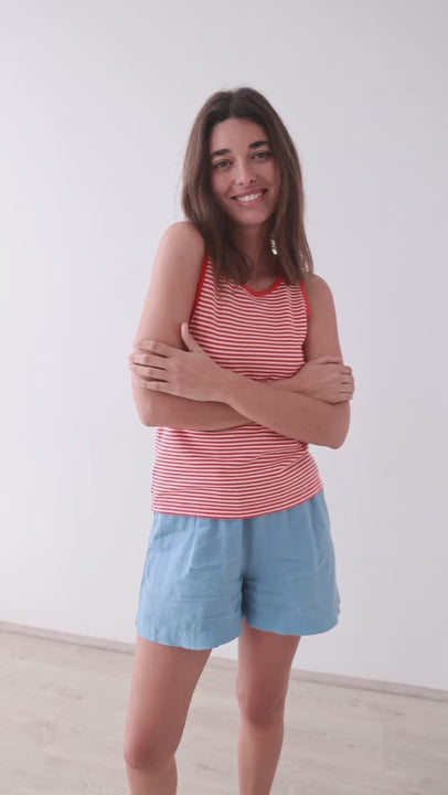 Bright red stripes lightweight vest top women light blue shorts full body view