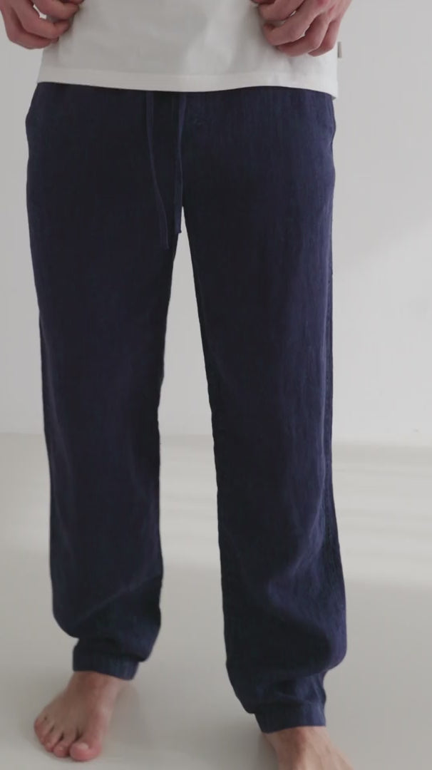 Navy blue heavy linen pants men striped tshirt full body view