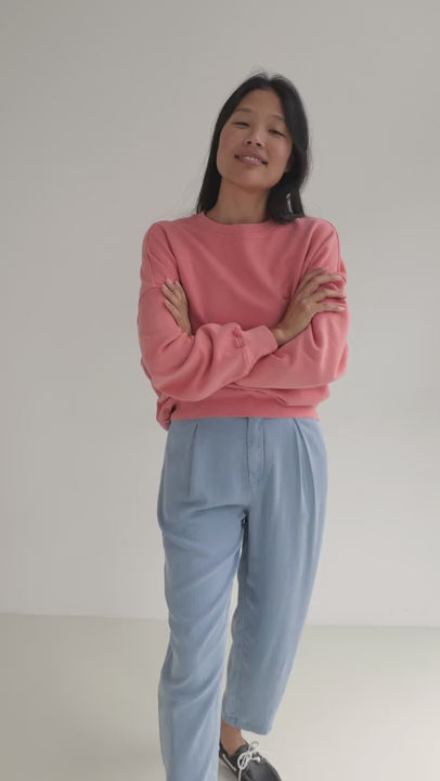 Denim blue lyocell pants women pink sweatshirt full body view