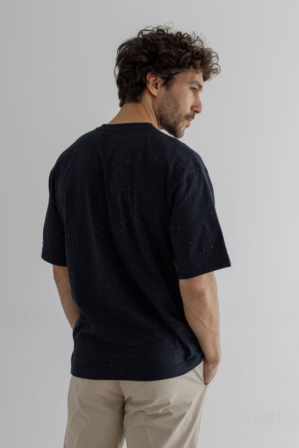 Black Oversized t-shirt men light pants wear view back