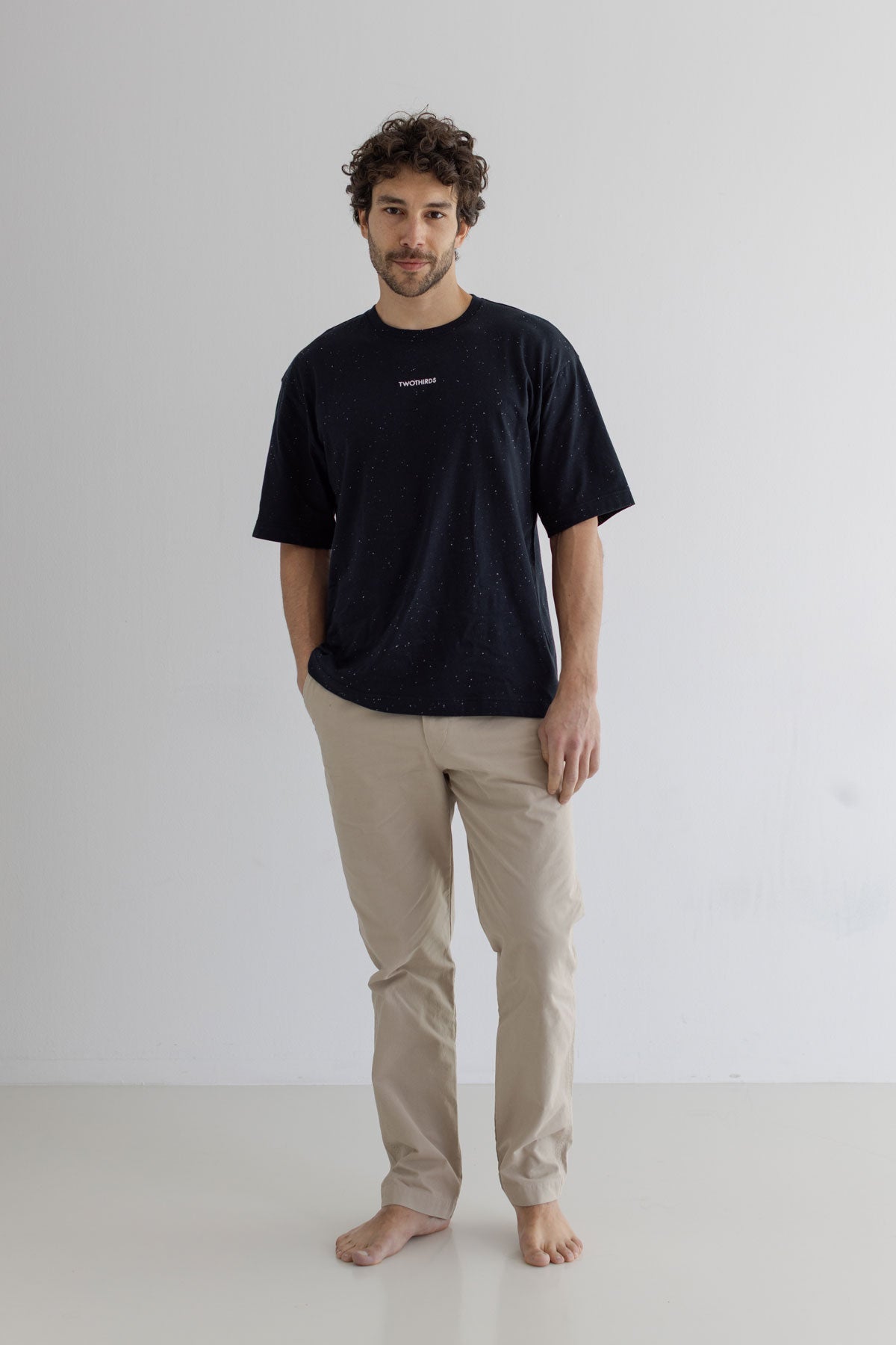 Black Oversized t-shirt men light pants full body view front